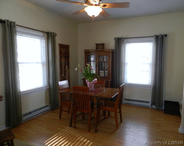 1611 Windsor Road Dutton, VA 23050 - Photo 9 of 30 a view of a dining room with furniture window and wooden floor