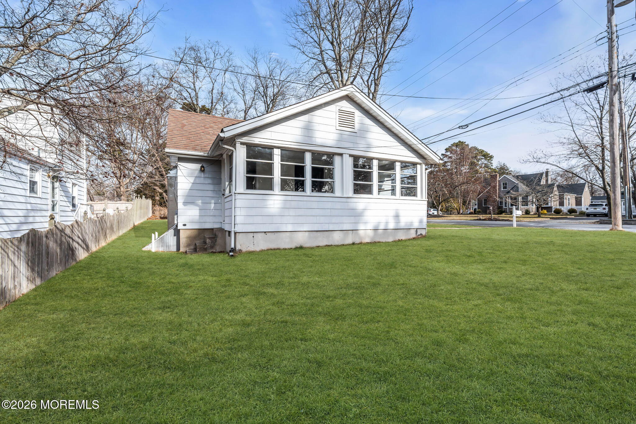 2609 River Road Manasquan, NJ 08736 - Photo 12 of 28 a front view of house with yard and green space