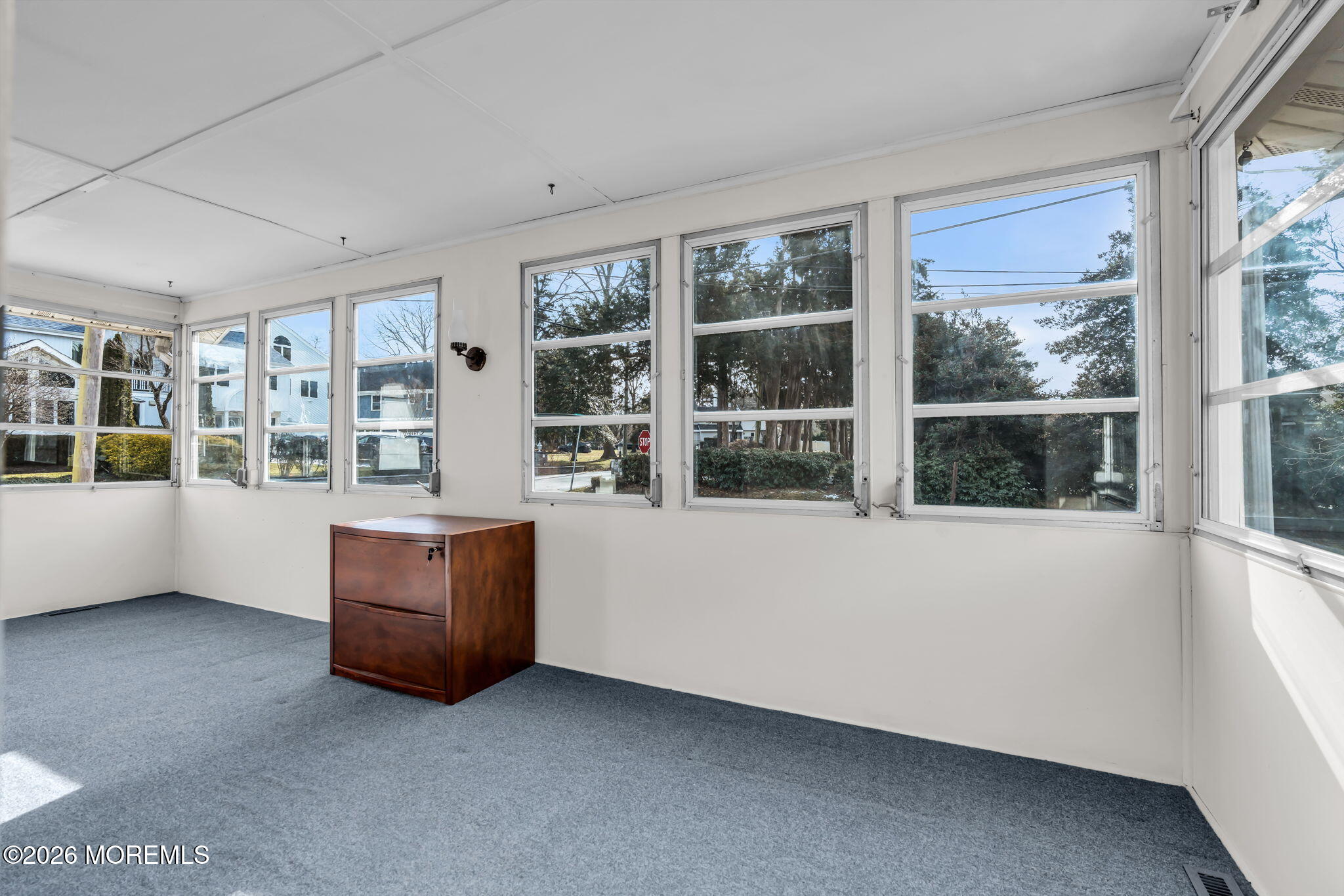 2609 River Road Manasquan, NJ 08736 - Photo 13 of 28 a living room with furniture and windows