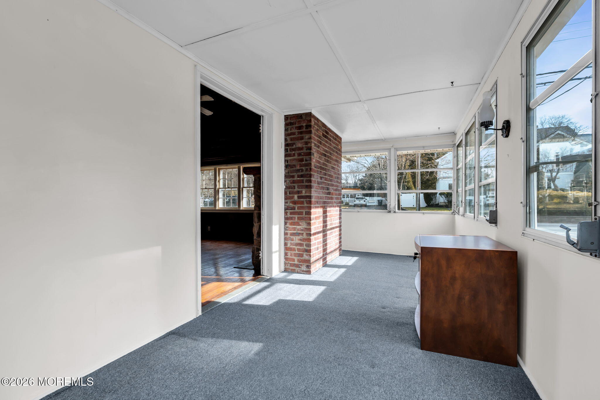 2609 River Road Manasquan, NJ 08736 - Photo 17 of 28 a view of an empty room with a fireplace