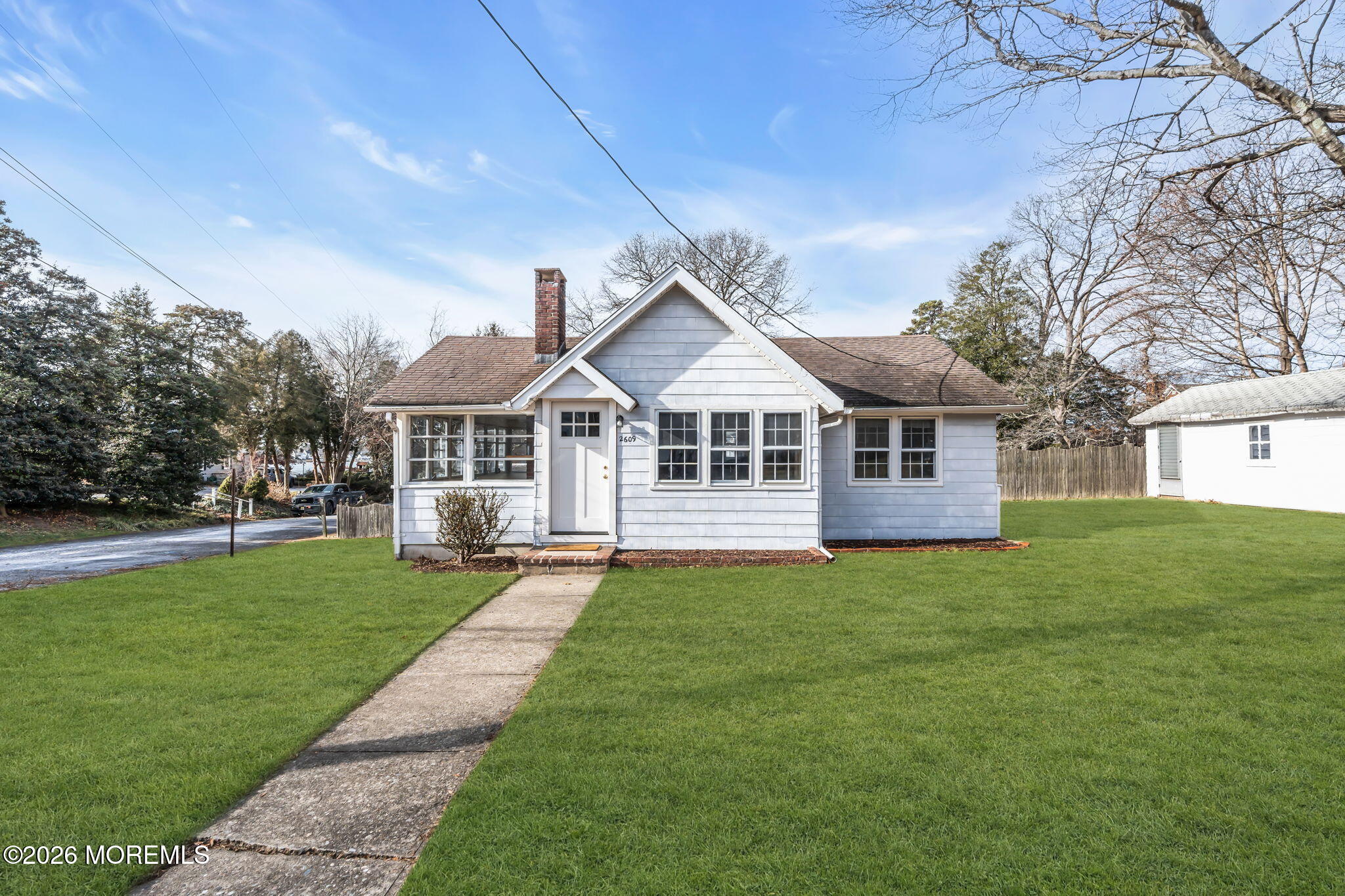 2609 River Road Manasquan, NJ 08736 - Photo 10 of 28 a front view of a house with a yard