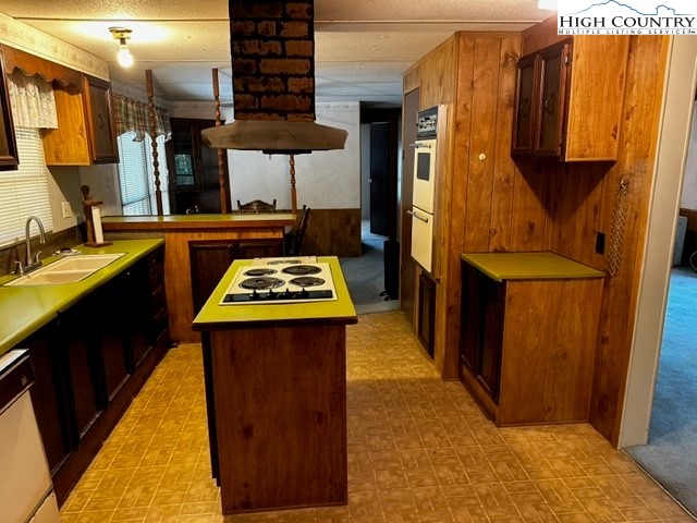 1426 Rainbow Trail Boone, NC 28607 - Photo 18 of 48 a kitchen with stainless steel appliances granite countertop sink stove and refrigerator