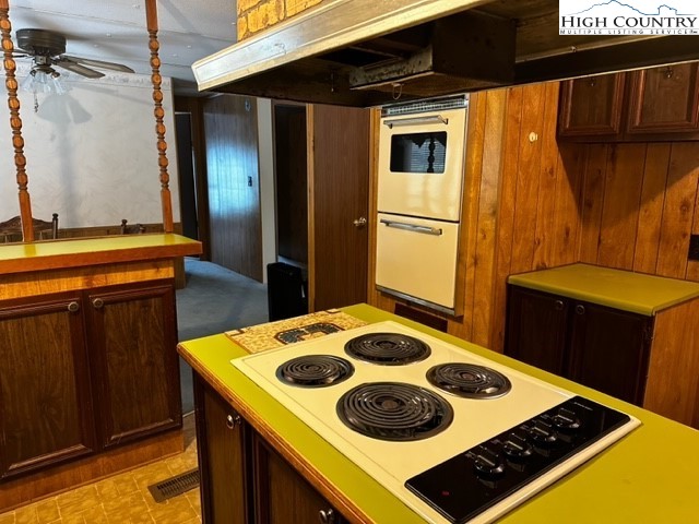 1426 Rainbow Trail Boone, NC 28607 - Photo 22 of 48 a kitchen with a stove a refrigerator and a dining table