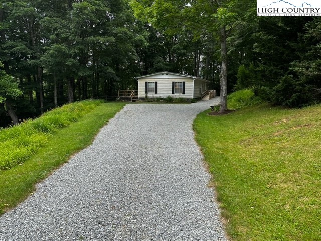 1426 Rainbow Trail Boone, NC 28607 - Photo 33 of 48 a house with a yard