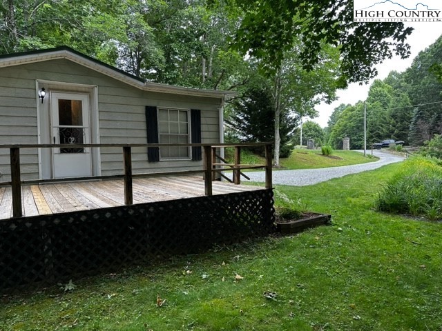 1426 Rainbow Trail Boone, NC 28607 - Photo 37 of 48 a view of a house with backyard and a tree
