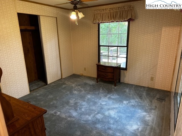 1426 Rainbow Trail Boone, NC 28607 - Photo 4 of 48 an empty room with windows and ceiling fan