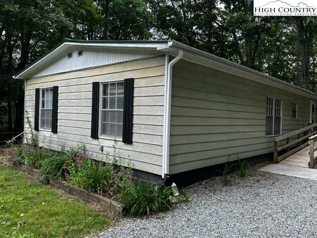 1426 Rainbow Trail Boone, NC 28607 - Photo 44 of 48 a view of a small house with a yard