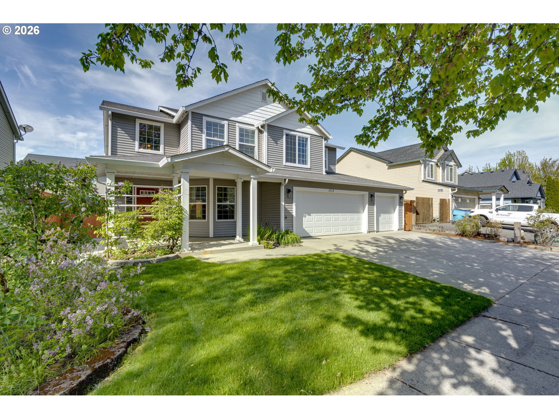 1312 Northwest 9th Way Battle Ground, WA 98604 - Photo 3 of 39 a front view of a house with a garden
