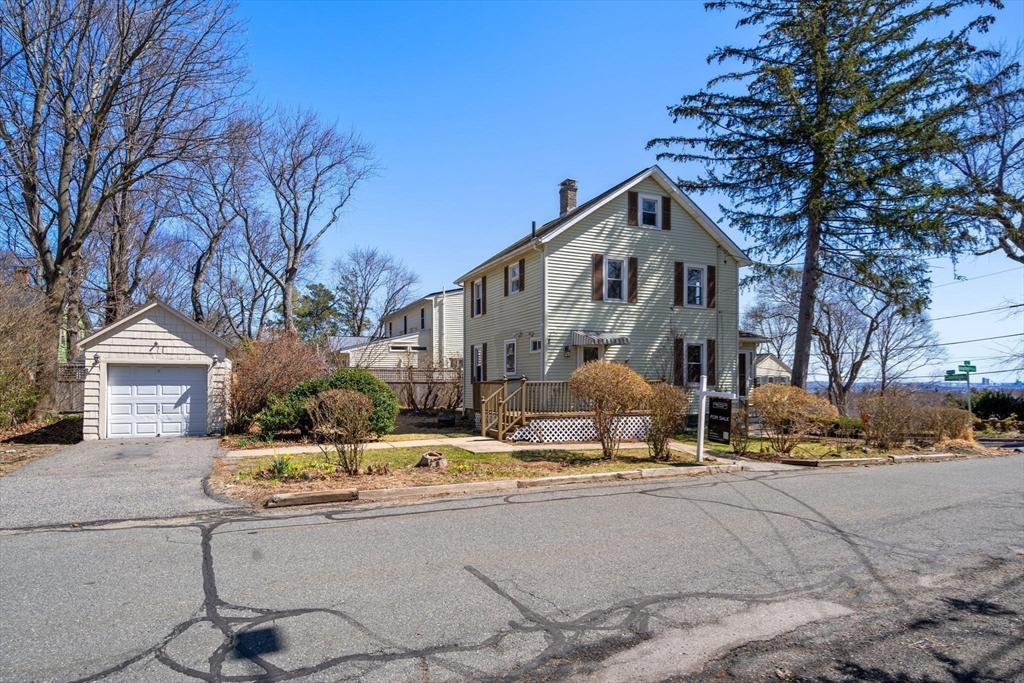 89 Coolidge Road Arlington, MA 02476 - Photo 1 of 22 a view of a house with snow on the road