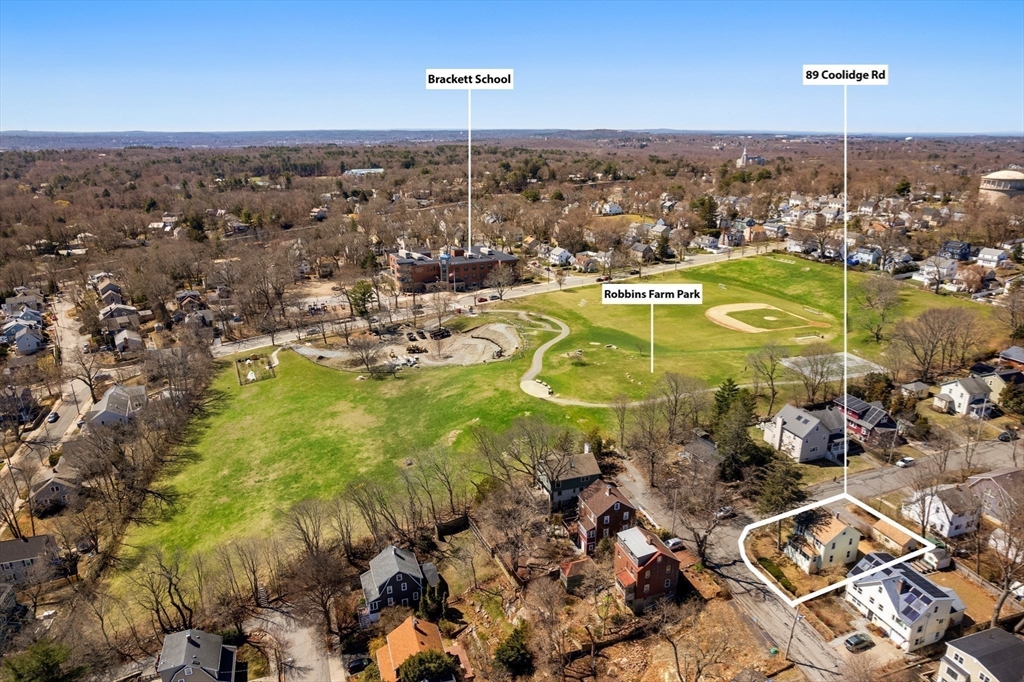 89 Coolidge Road Arlington, MA 02476 - Photo 19 of 22 an aerial view of residential houses with outdoor space and swimming pool