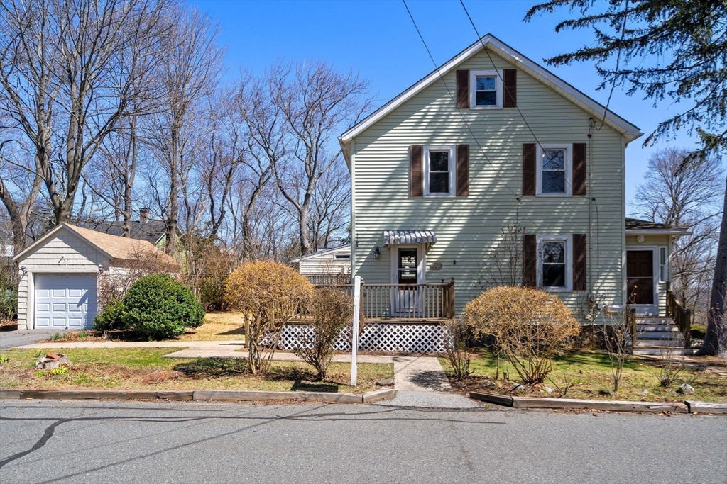 89 Coolidge Road Arlington, MA 02476 - Photo 20 of 22 a front view of a house with basket ball court