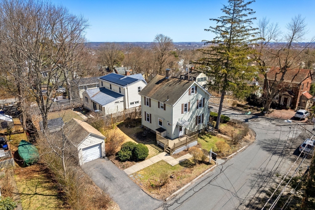 89 Coolidge Road Arlington, MA 02476 - Photo 2 of 22 a view of a house with a yard
