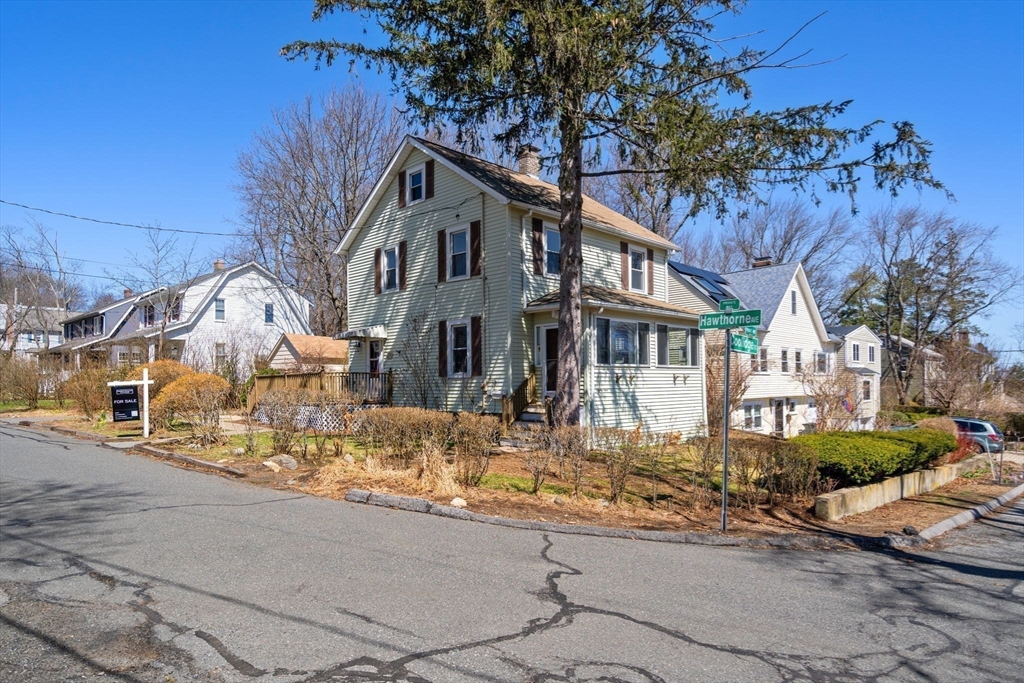 89 Coolidge Road Arlington, MA 02476 - Photo 21 of 22 a front view of a house with a tree