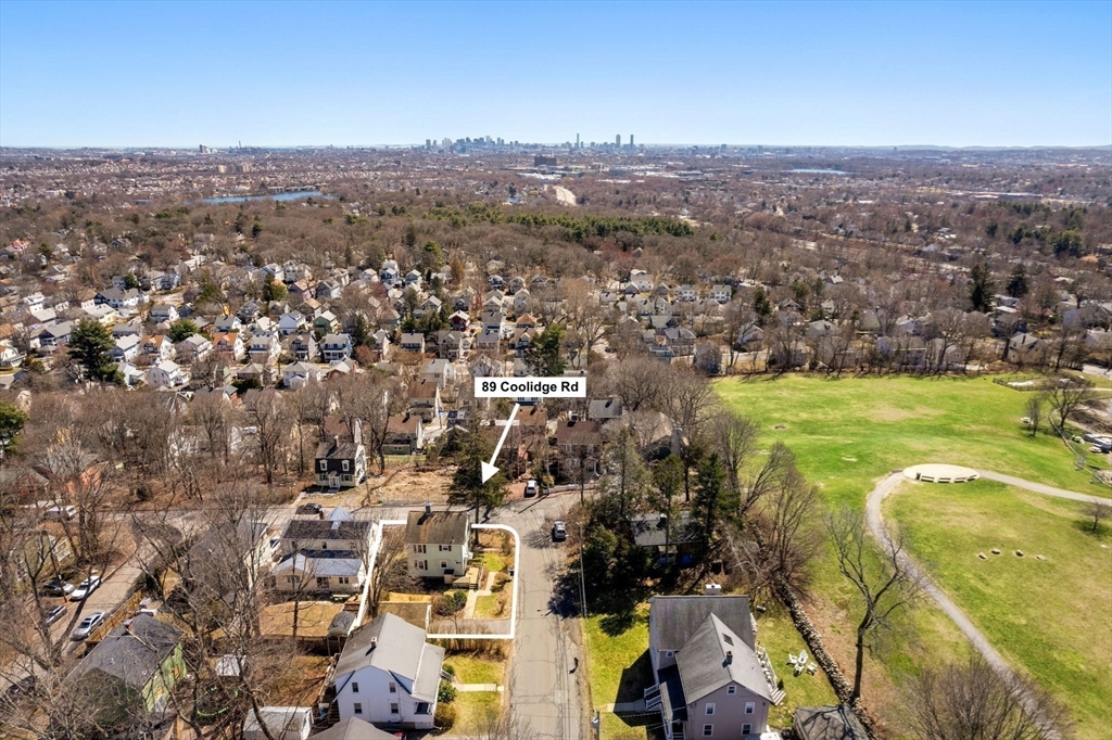 89 Coolidge Road Arlington, MA 02476 - Photo 3 of 22 an aerial view of residential building with outdoor space