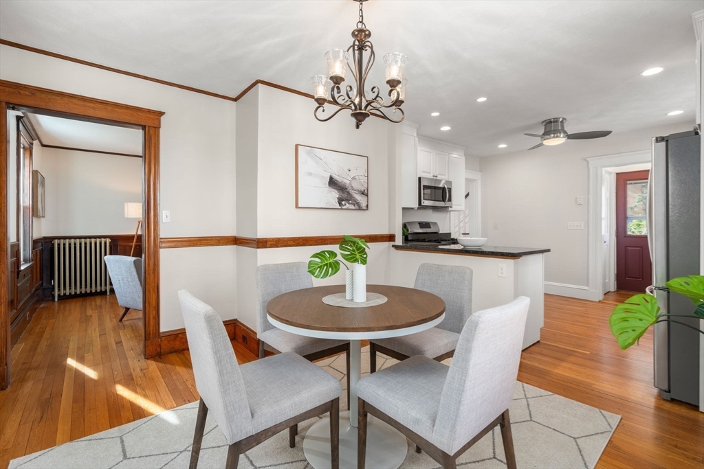 89 Coolidge Road Arlington, MA 02476 - Photo 7 of 22 a view of a dining room with furniture and wooden floor