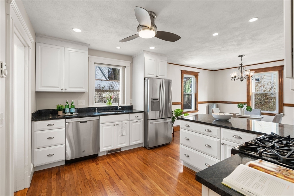 89 Coolidge Road Arlington, MA 02476 - Photo 8 of 22 a kitchen with stainless steel appliances sink stove top oven and cabinets