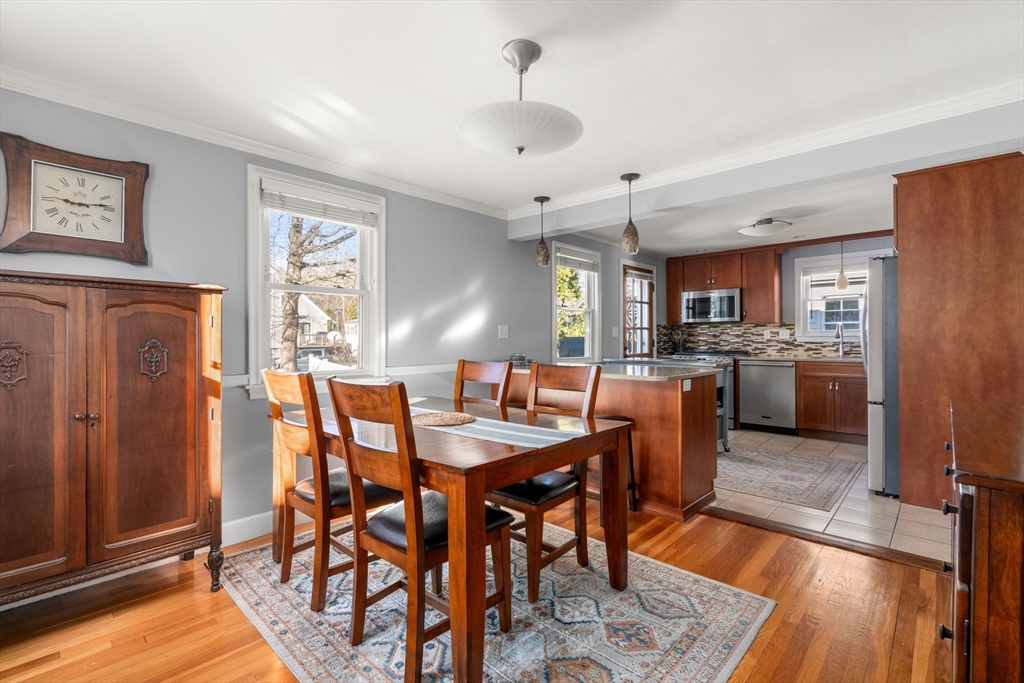 64 Newfield Street Boston, MA 02132 - Photo 12 of 36 a view of a dining room with furniture and wooden floor
