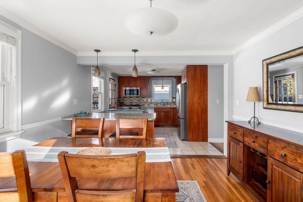 64 Newfield Street Boston, MA 02132 - Photo 13 of 36 a large kitchen with a table and chairs
