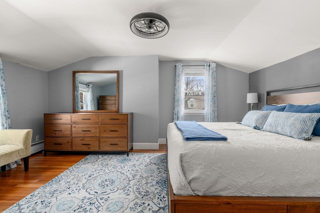 64 Newfield Street Boston, MA 02132 - Photo 17 of 36 a bedroom with a bed and furniture