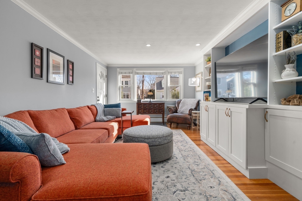 64 Newfield Street Boston, MA 02132 - Photo 2 of 36 a living room with furniture and a rug