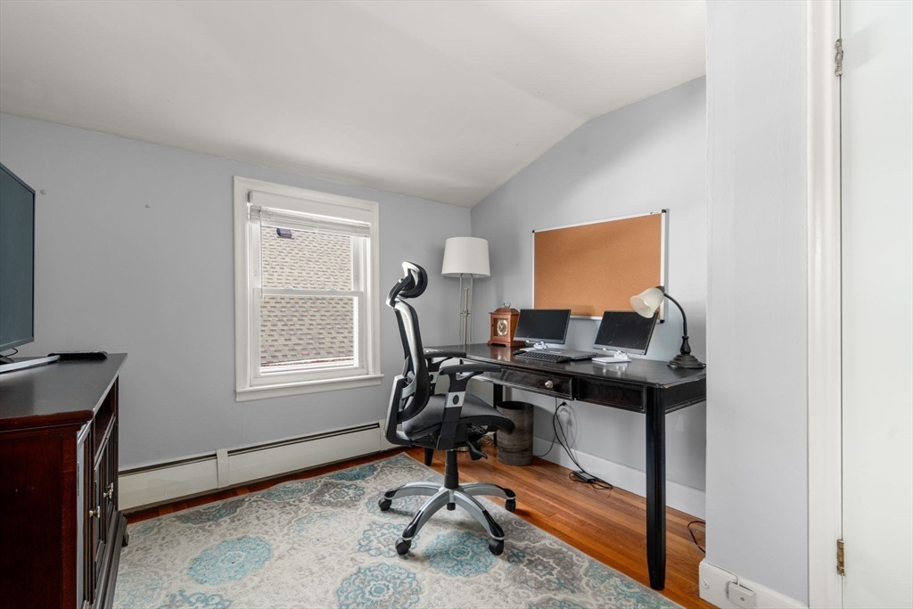 64 Newfield Street Boston, MA 02132 - Photo 21 of 36 a view of a workspace with furniture and a window