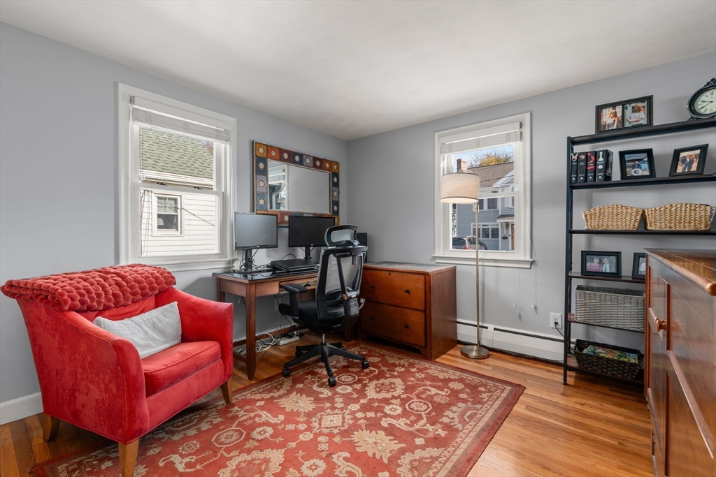 64 Newfield Street Boston, MA 02132 - Photo 24 of 36 a living room with furniture rug and window