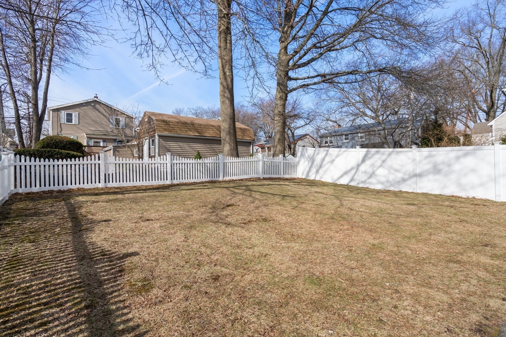 64 Newfield Street Boston, MA 02132 - Photo 30 of 36 a view of backyard with large trees