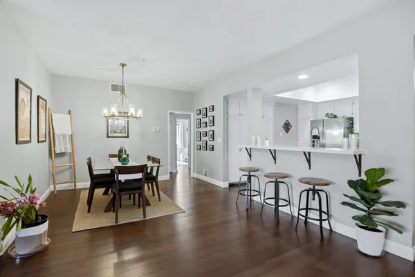 a view of a dining room with furniture window and wooden floor