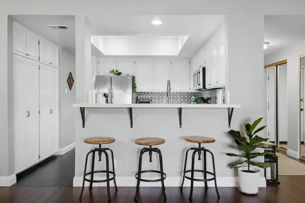 a view of a dining room with furniture and wooden floor