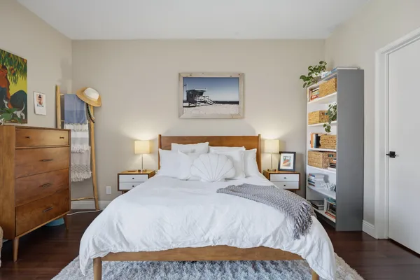 a bedroom with a bed and a closet