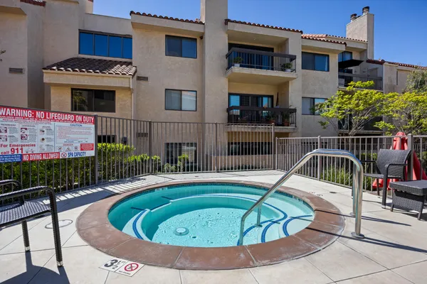 a view of a swimming pool with a lounge chairs