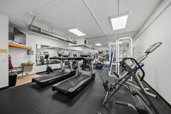 a gym room with gym equipment