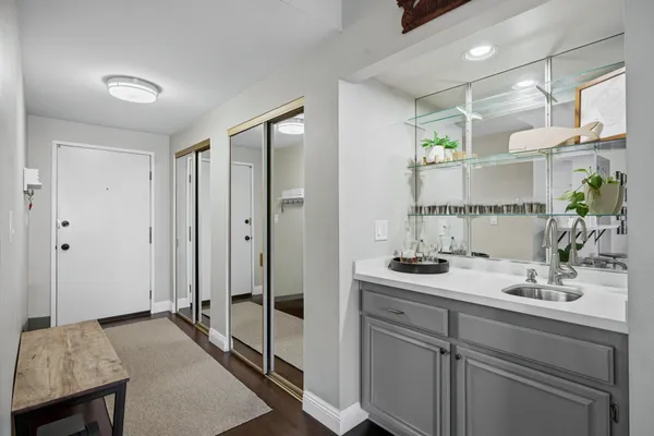 a bathroom with a sink and a mirror