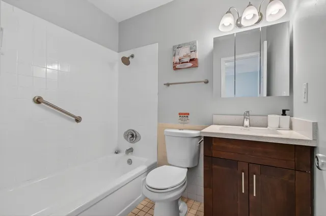 a bathroom with a sink a toilet and a bathtub