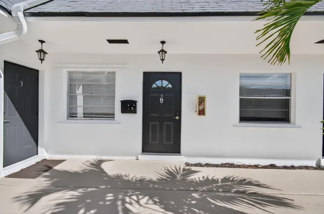 a bedroom with a bed and a fireplace