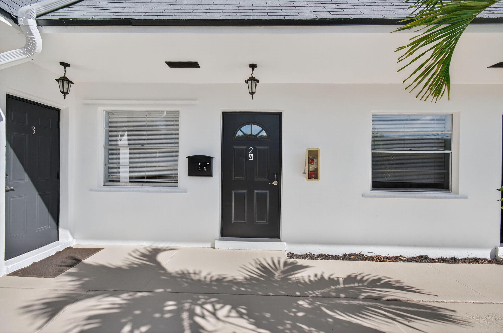 109 Southeast 11th Avenue, Unit 13 Pompano Beach, FL 33060 - Photo 22 of 37 a bedroom with a bed and a fireplace