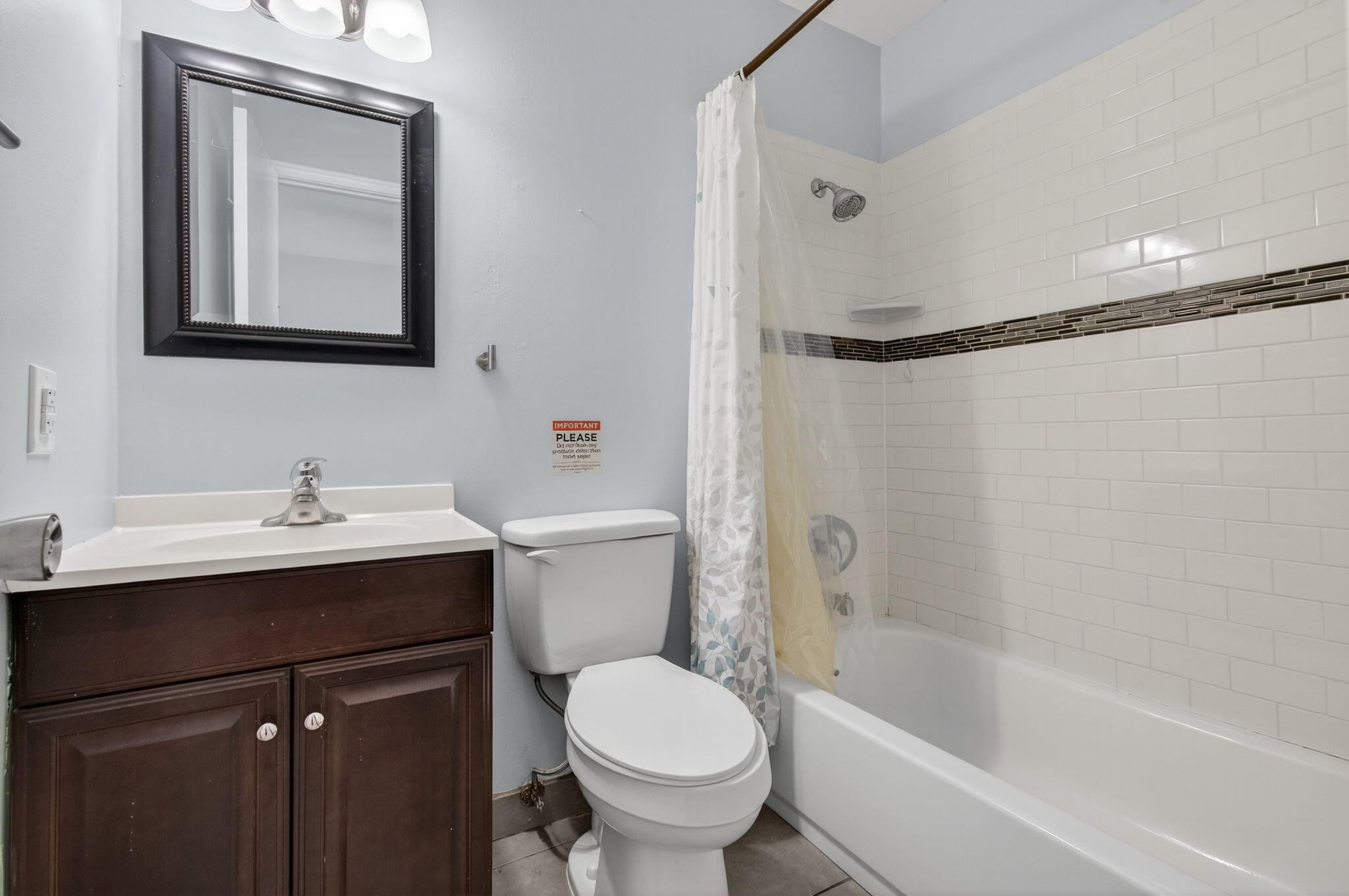 109 Southeast 11th Avenue, Unit 13 Pompano Beach, FL 33060 - Photo 35 of 37 a bathroom with a sink toilet and shower