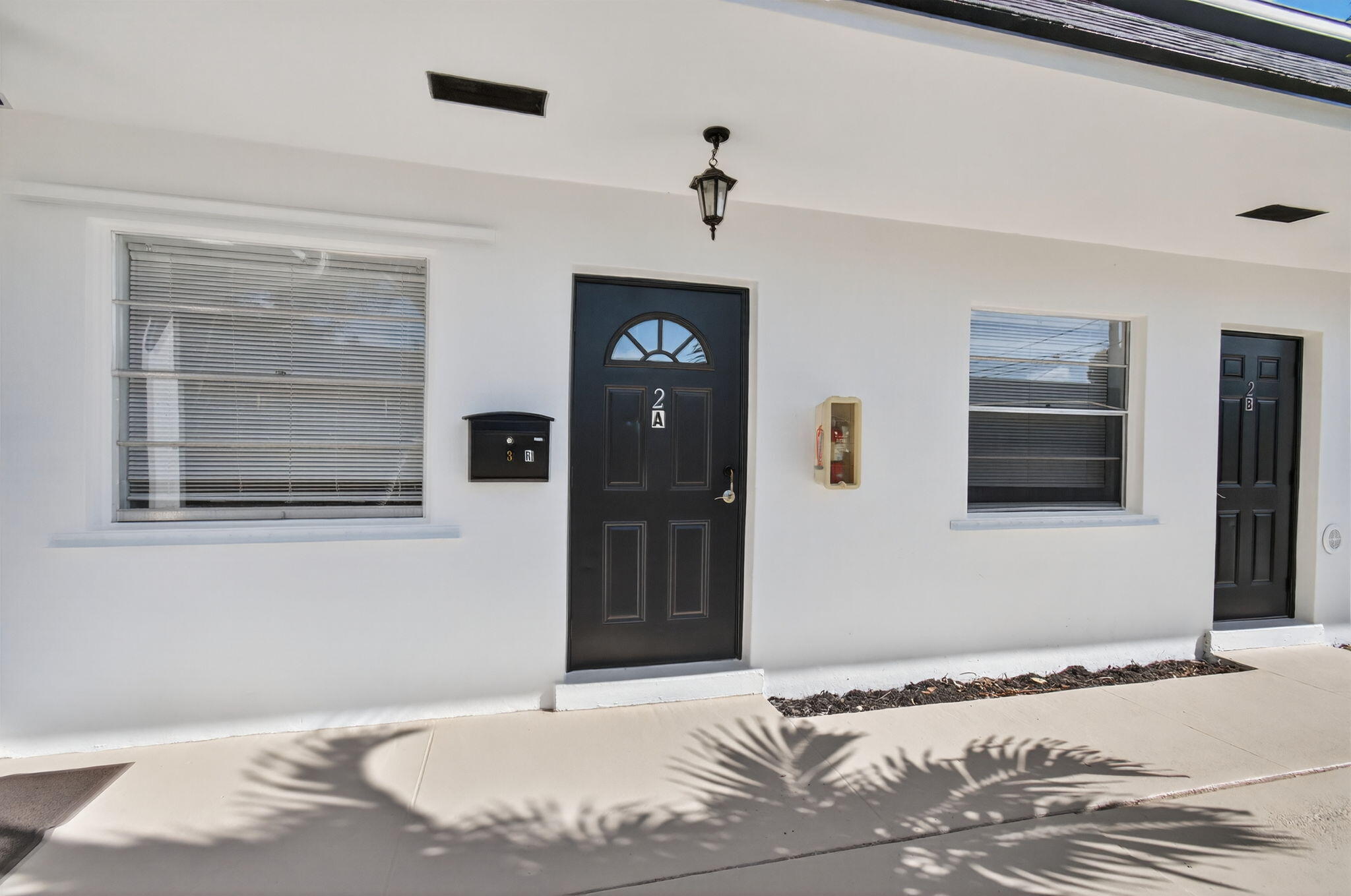 109 Southeast 11th Avenue, Unit 13 Pompano Beach, FL 33060 - Photo 4 of 37 a bedroom with a bed and a flat screen tv