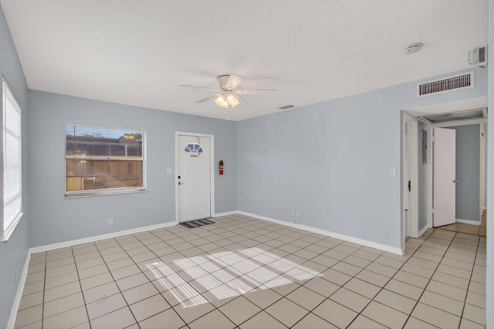 109 Southeast 11th Avenue, Unit 13 Pompano Beach, FL 33060 - Photo 9 of 37 a view of an empty room and window