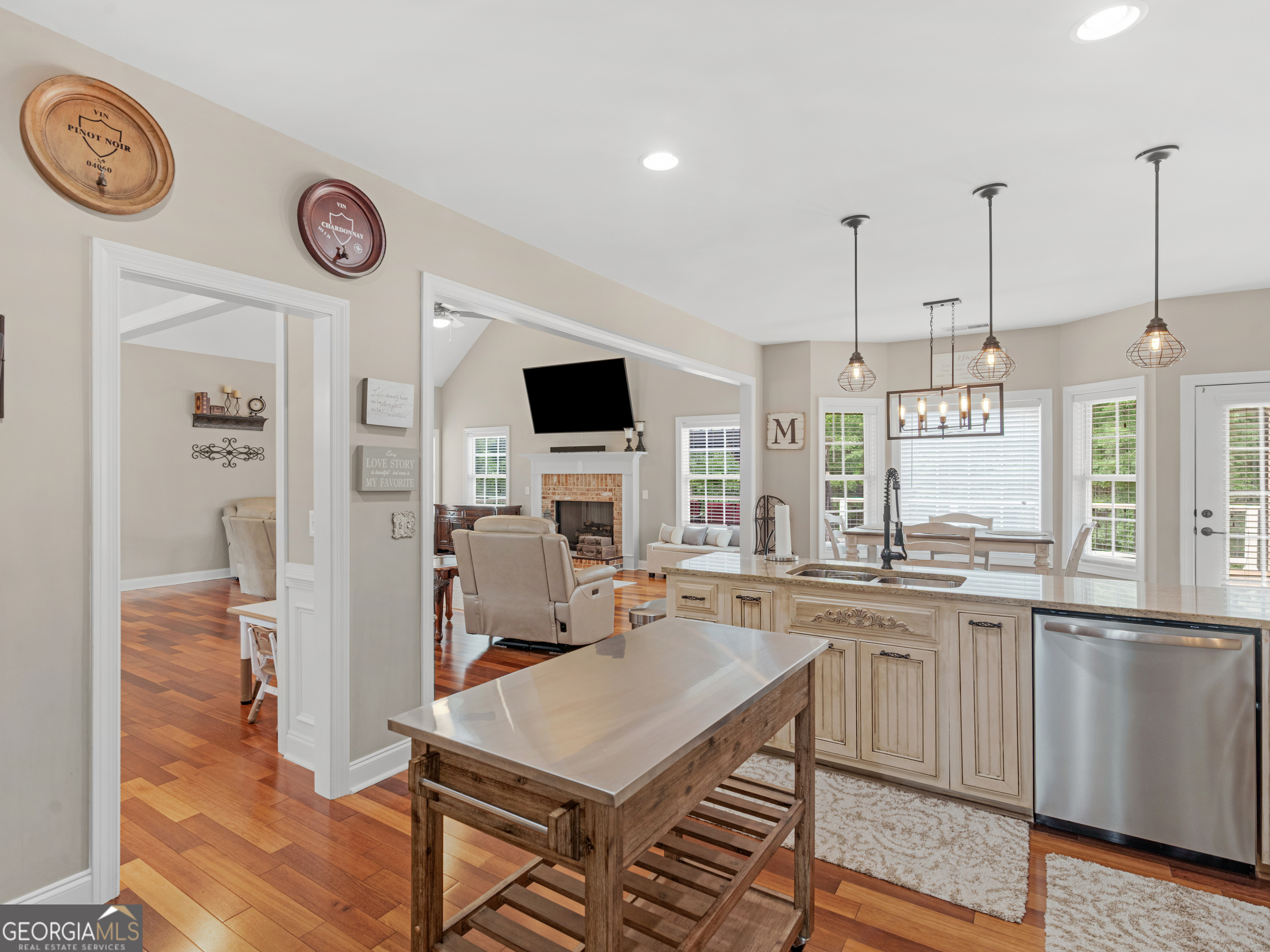 221 Hummingbird Court Hampton, GA 30228 - Photo 22 of 77 a open kitchen with stainless steel appliances granite countertop a stove and a sink