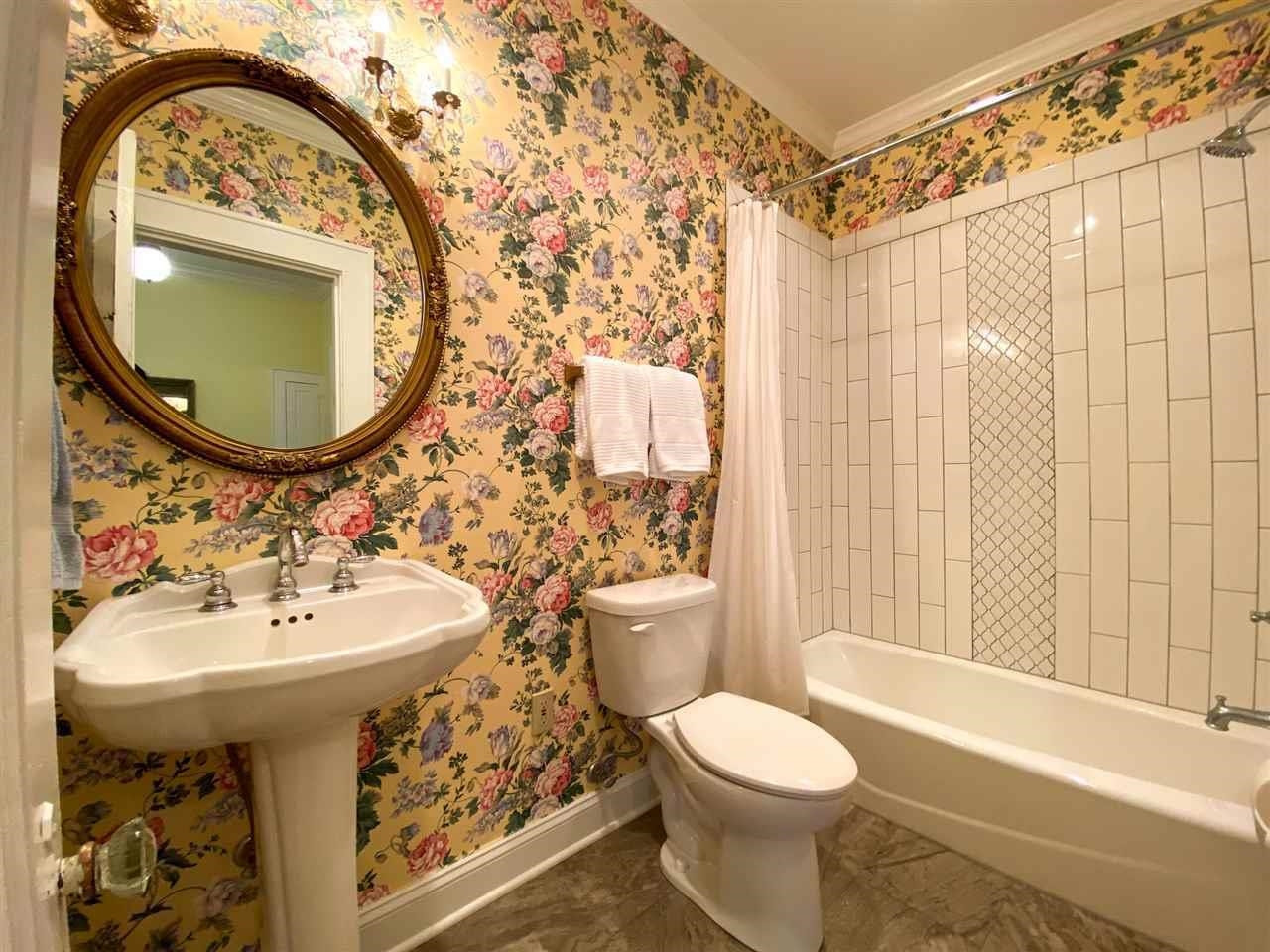 225 East 3rd Street Henderson, TN 38340 - Photo 19 of 22 a bathroom with a sink toilet and a mirror