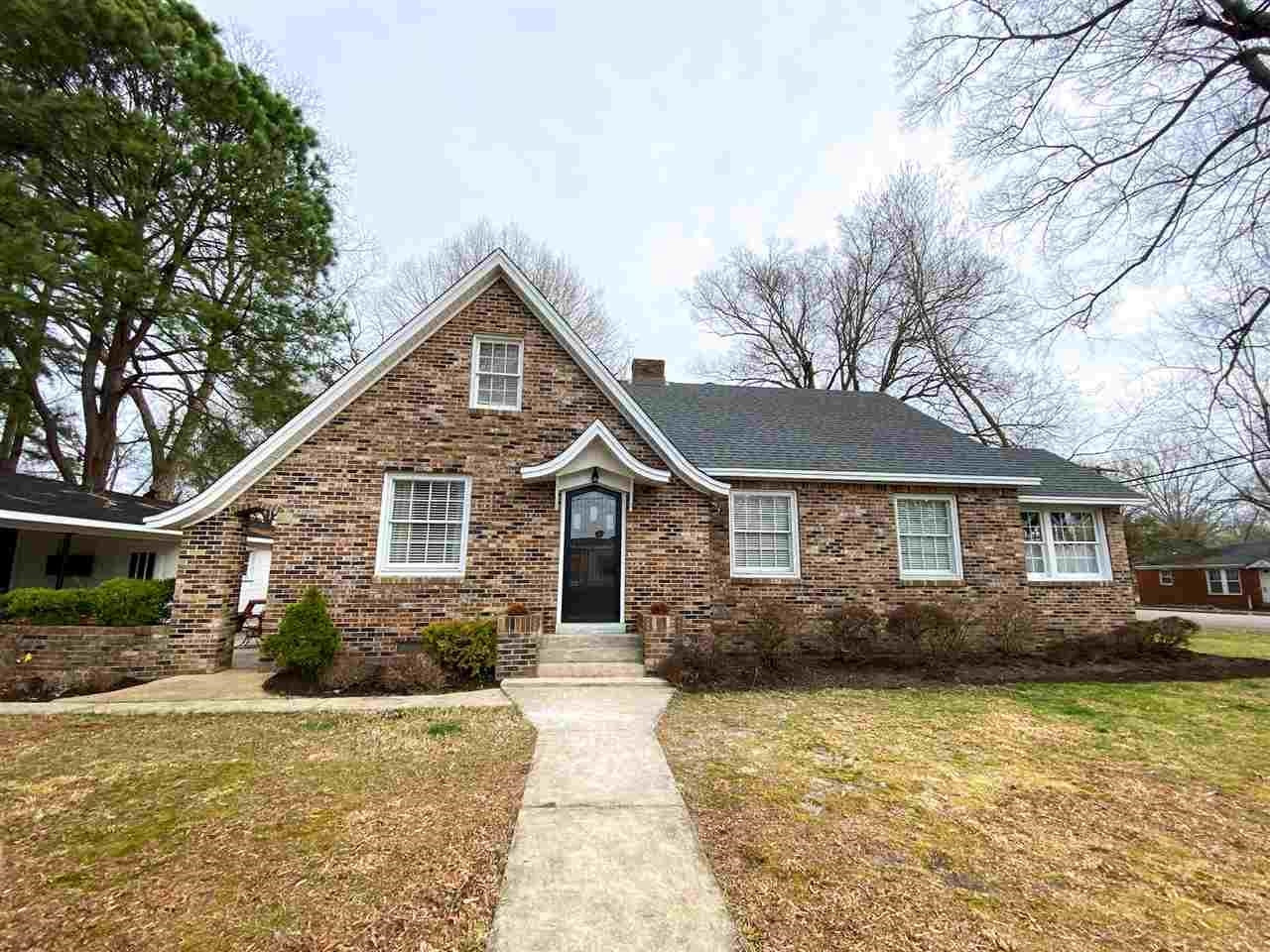 225 East 3rd Street Henderson, TN 38340 - Photo 2 of 22 a front view of house with yard and trees around