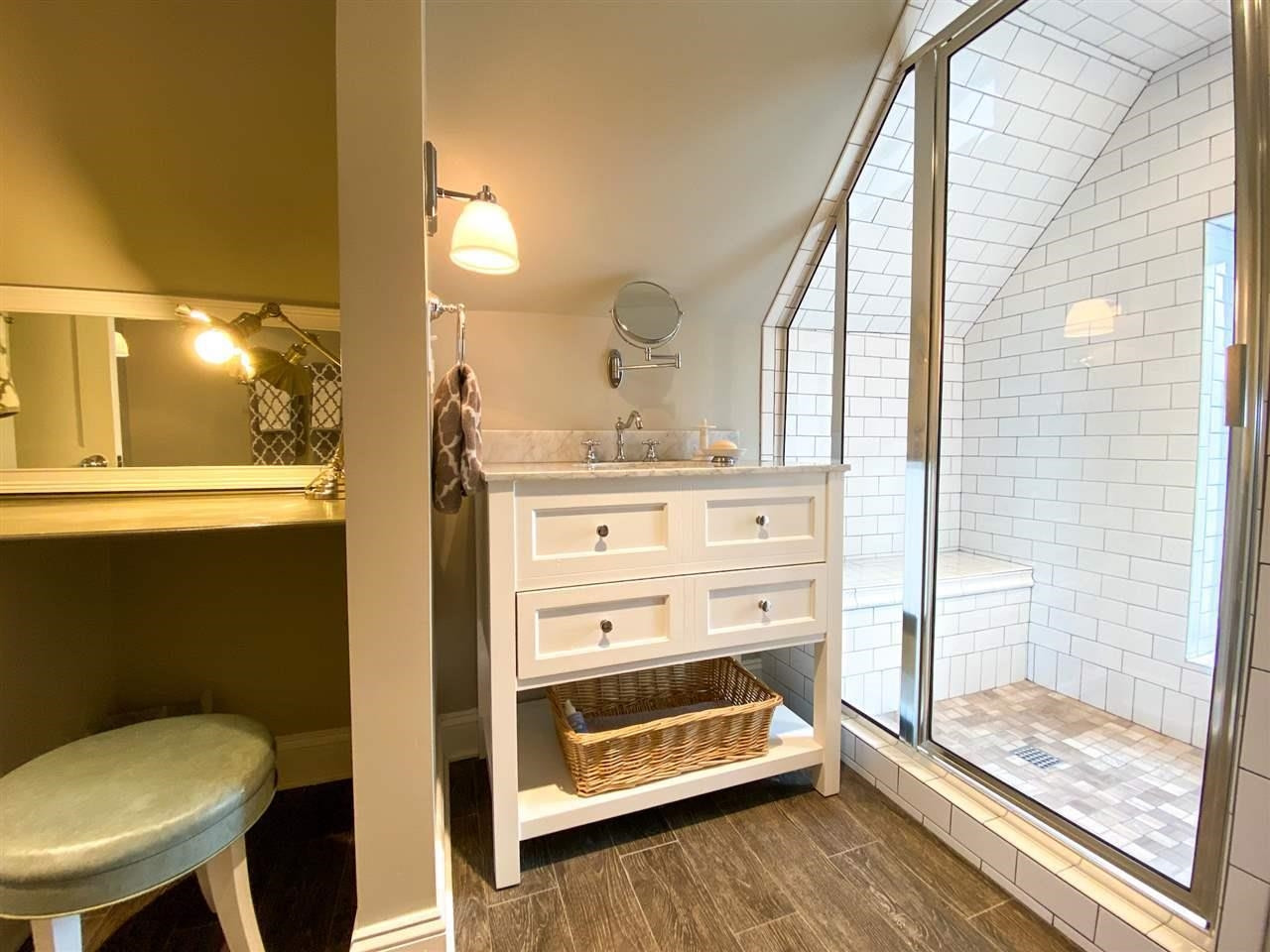 225 East 3rd Street Henderson, TN 38340 - Photo 21 of 22 a bathroom with a sink a toilet and a mirror