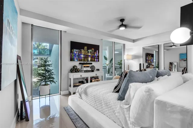 a bedroom with bed and a chandelier