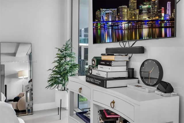 a view of a bedroom with furniture and windows