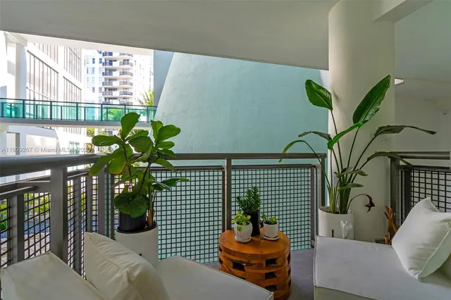 a view of a chair and table in the garden