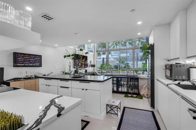 a kitchen with counter top space cabinets and appliances