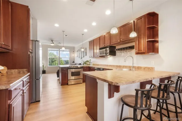 a kitchen with a stove oven and a refrigerator