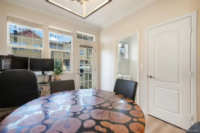a view of a dining room with furniture window and wooden floor