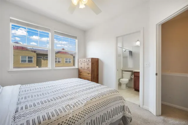 a bedroom with a bed and a night stand